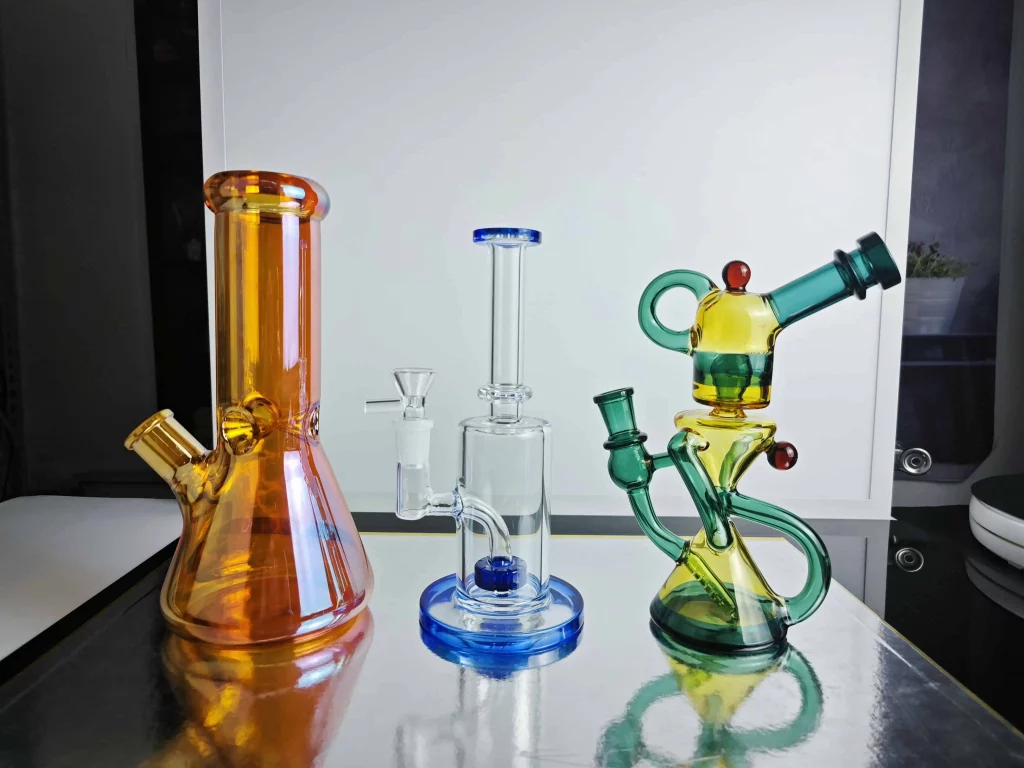Displaying different shapes of glass bongs such as Beaker, Straight tube, Recycler Bongs