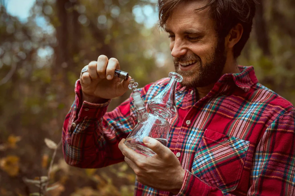 a man using a glass bong